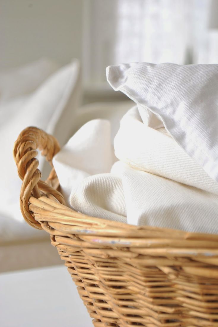 basket of folded linen to show cleaning services in utah